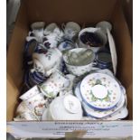 Sutherland China part tea service the cream ground painted flower decoration with blue rims and