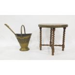 Circular brass topped coffee table on folding base with barley twist supports, brass coal bucket and