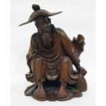 Chinese carved boxwood figure of seated man, with detachable hat, 23cm high