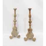 Pair of modern Italian altar-style turned and carved candle prickets raised on baluster triform base