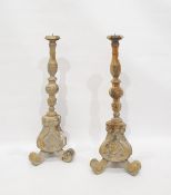 Pair of modern Italian altar-style turned and carved candle prickets raised on baluster triform base