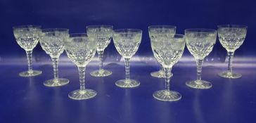 Set of nine William Yeoward cut glass goblets each with ovoid bowl having relief diamond band