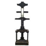 Victorian gothic style coat and umbrella stand with carved decoration, central rectangular mirror,