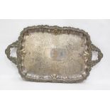 19th century silver plated two handled tray, rounded oblong, the centre allover chased and having