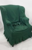 Early 20th century wingback armchair in loose green covers