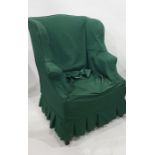 Early 20th century wingback armchair in loose green covers