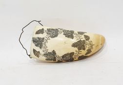 Scrimshaw tusk carved with grapes on vine decoration