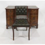 20th century mahogany desk with green tooled leather inset top above the shaped front, nine assorted