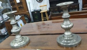 Pair of large turned and weighted table centrepiece candlesticks