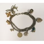 Silver-coloured metal herringbone-pattern chain bracelet with tassel and various charms