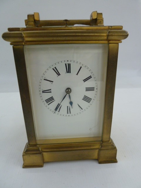 19th century French repeater carriage clock with reeded bar handles, on angular and scroll ends,
