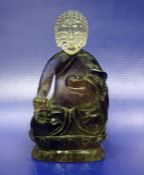 Chinese carved rock crystal figure of seated Buddha on lotus flower, 9.5cm highCondition ReportThe