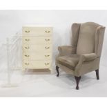 Cream painted chest of five drawers, a wing-back chair and a white painted towel airer (3)