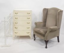 Cream painted chest of five drawers, a wing-back chair and a white painted towel airer (3)