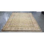 Golden ground Eastern rug with allover foliate decoration in pinks, greens, blues, yellows and