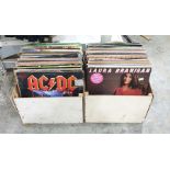 Two boxes of 12" singles records to include examples by AC/DC "Rock and Roll Ain't Noise