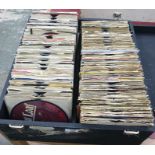 Two cases of assorted 45 rpm singles, various artists to include: Meatloaf, David Bowie, Black