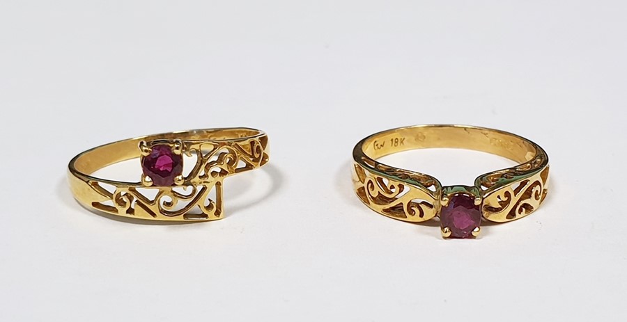 Two 18ct gold and ruby rings, each set single stone in pierced setting (2)  Condition ReportThe