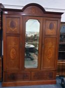 Late 19th/early 20th century mahogany inlaid wardrobe, the dome top with ogee moulded pediment,