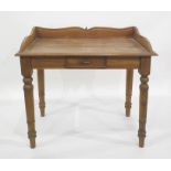 Eastern hardwood side table, three-quarter galleried top above single drawer on turned supports,