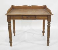 Eastern hardwood side table, three-quarter galleried top above single drawer on turned supports,