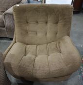 Mid twentieth century Englander designer swivel chair, upholstered in brown with buttonback