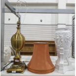 Large brass lamp of ovoid form on stepped base with rust-coloured shade and a white ceramic