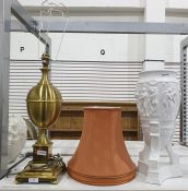 Large brass lamp of ovoid form on stepped base with rust-coloured shade and a white ceramic