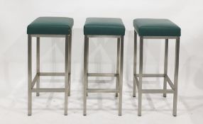 Five bar stools on brushed steel bases with green vinyl seats (5)