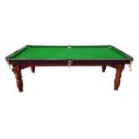 Half size snooker table, with green baize the frame supported by turned legs, 225 cms x 117.5w.