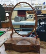 19th century figured mahogany oval frame swing toilet mirror on serpentine-fronted box base with