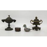 Two Regency bronze Pastille burners, one with squirrel finial with moth handles, the other with