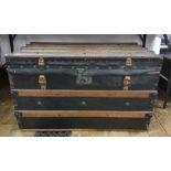 Wooden batoned black leather and studded steamer-type trunk, either end emblazoned with the initials