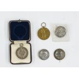 Three WWI silver war badges, Royal Sussex Regiment silver medal in fitted case, WWI Victory medal