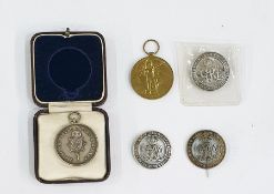 Three WWI silver war badges, Royal Sussex Regiment silver medal in fitted case, WWI Victory medal