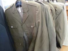 Various British army uniforms, box of caps, a US Navy mess jacket and two vintage leather satchels