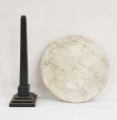 Circular white marble board and a black slate obelisk (2)