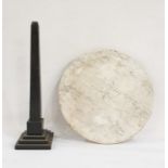 Circular white marble board and a black slate obelisk (2)