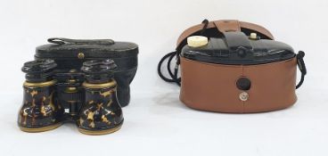 Pair of faux tortoiseshell opera glasses within original leather case, initial JHM and a bakelite