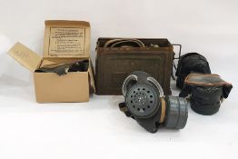 Three assorted gas masks, belts and ammunition tin