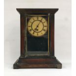 Mahogany-cased mantel clock with Roman numerals to the dial, swept plinth base, block feet