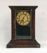 Mahogany-cased mantel clock with Roman numerals to the dial, swept plinth base, block feet