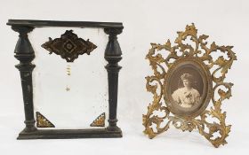 Glazed panel with painted artwork, probably early 20th century and rococo-style scrolling brass