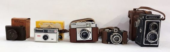 Five assorted cameras to include VP Twin bakelite pocket camera in original box, Kodak 104