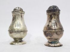 Two Georgian silver muffineers of baluster form (Makers Marks indistinct, London)