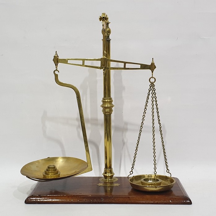 19th century brass weighing scales on mahogany plinth base, stamped with label 'Cooperative