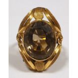 Gold coloured metal and smokey quartz dress ring