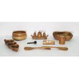 Wooden desktop calendar and a collection of carved bowls, table utensils, etc