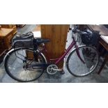 Raleigh lady's 48cm (19") frame bicycle fitted with a basket, a bicycle helmet and a rucksack basket