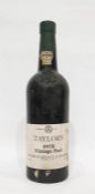 Bottle of Taylors 1975 vintage port, label is complete, wax capsule top is damaged but present